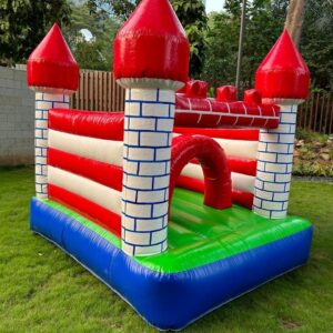Bright red castle-themed bounce house for children’s parties