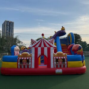 Colorful carnival fun city bounce house with slides and play area