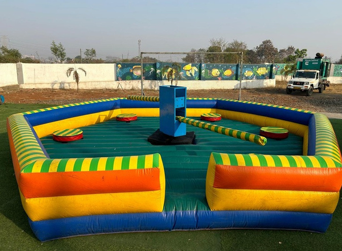 Eliminator inflatable game with rotating arm challenge