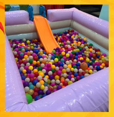 Pastel ball pit for kids with soft-colored plastic balls